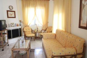 A seating area at Holiday Apartment Flogita