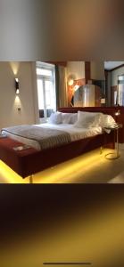 a large bed in a room with a window at Valdevebas Chalet con Piscina in Madrid