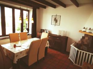 a dining room with a table and some chairs at Klakbaan 14 in IJzendijke
