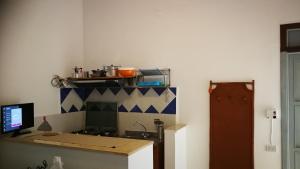 a kitchen with a stove and a counter top at VisitPonza - Palazzetto Azzurro in Ponza +29 photos