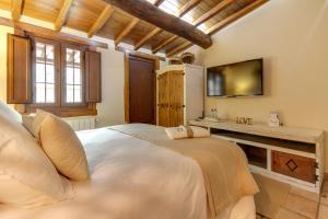 TV a/nebo společenská místnost v ubytování Casa Rural A Cashiña da Lagarteira