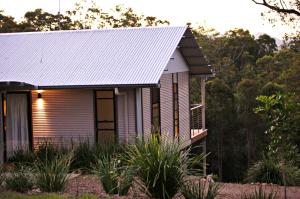 a small house with a tin roof at Melawondi Spring Retreat in Imbil
