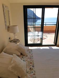 A bed or beds in a room at Atico con Impresionantes Vistas