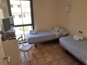 A bed or beds in a room at Atico con Impresionantes Vistas