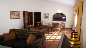 a living room with a couch and a table at Exclusively located Golf Villa with heated pool in San Miguel de Abona