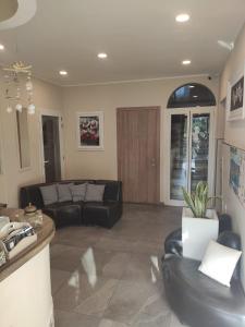 a living room with a couch and a table at Albergo Torino in Albenga