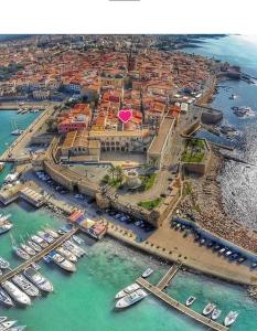 an aerial view of a harbor with boats in the water at Alghero Old Town Apartment in Alghero
