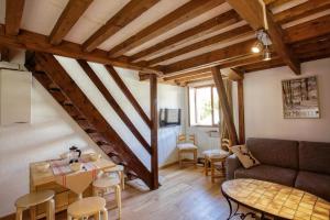 a living room with a couch and a table at La Bergerie in Les Deux Alpes