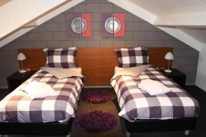 מיטה או מיטות בחדר ב-Vakantiewoning Pardoes
