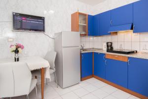 Kuchyňa alebo kuchynka v ubytovaní Apartments Palmic