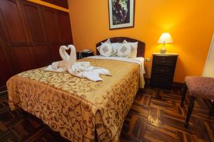 Postel nebo postele na pokoji v ubytování Hotel Suite Plaza