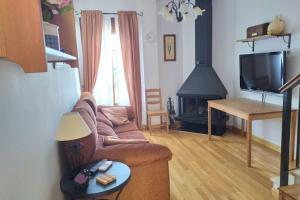 Televízia a/alebo spoločenská miestnosť v ubytovaní Vivienda Majaceite