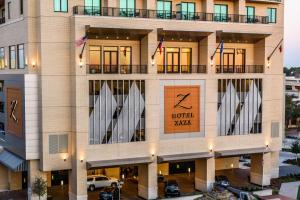 a hotel with surfboards on the front of it at Hotel ZaZa Houston Memorial City in Houston