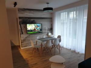 TV a/nebo společenská místnost v ubytování Rewal Resort Klifowa - Morska 3/3