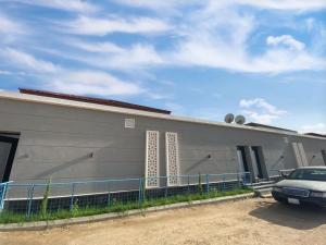 a building with a car parked in front of it at Taif promise Chalets in Taif