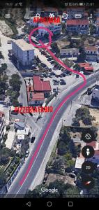 a street with a road with red markings on it at Apartment Golden Dreams in Podstrana