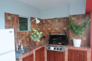 Kuchyň nebo kuchyňský kout v ubytování Marbella Malecon
