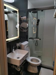 Vannituba majutusasutuses Gonik Apartmani
