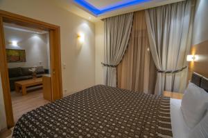 Postel nebo postele na pokoji v ubytování Pantelidis Hotel & Spa