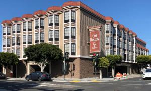 a large building on the corner of a street at Cow Hollow Inn and Suites in San Francisco