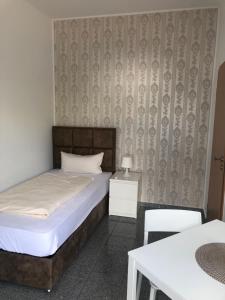 Postel nebo postele na pokoji v ubytování Hotel Restaurant Artemis
