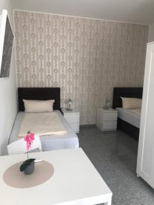 Postel nebo postele na pokoji v ubytování Hotel Restaurant Artemis