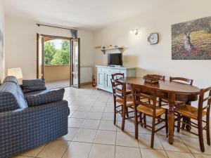 a living room with a table and a couch at Elegant Holiday Home in Sorano with Swimming Pool in Sorano