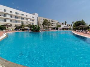 a large blue swimming pool in front of a building at Marina-G in Lagos