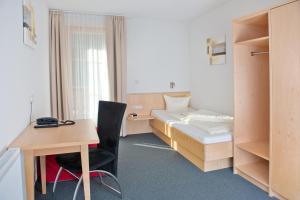 Postel nebo postele na pokoji v ubytování Hotel Garni Ragaz