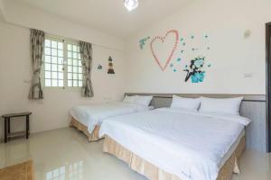 Cama o camas de una habitación en 實在玩家民宿