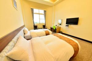 Ένα ή περισσότερα κρεβάτια σε δωμάτιο στο HUYE resort