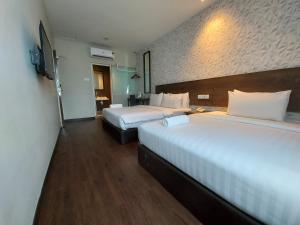 Voodi või voodid majutusasutuse MIICO Hotel @ Mount Austin toas