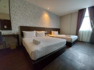Voodi või voodid majutusasutuse MIICO Hotel @ Mount Austin toas