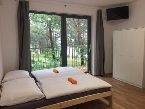 Кровать или кровати в номере KuK Račice - mini apartman