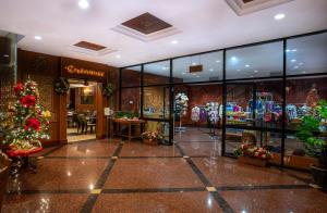 a store lobby with a christmas tree and windows at Century Pines Resort Cameron Highlands in Cameron Highlands