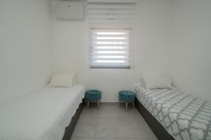 Voodi või voodid majutusasutuse Maorissimo Boutique Apartment toas