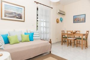 A seating area at ILIOCHARI sea view apartments Oropos - Kalamos