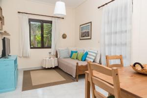 A seating area at ILIOCHARI sea view apartments Oropos - Kalamos