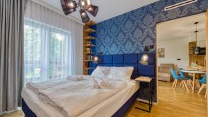 Posteľ alebo postele v izbe v ubytovaní Apartament 41 Holiday Mountain Residence - 5D Apartamenty