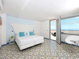 Postel nebo postele na pokoji v ubytování Hotel Villa Felice Relais
