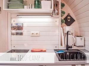 a kitchen with a sink and a counter top at Campingoase Eider in Hennstedt