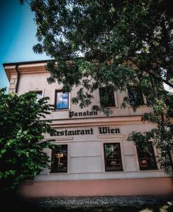 a building with the words free tenant kitchen on it at Restaurant Pansion Wien in Čierny Brod