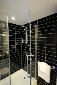 a bathroom with a shower stall and a sink at Holiday Inn Express Sheffield City Centre, an IHG Hotel in Sheffield