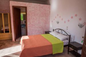 Postel nebo postele na pokoji v ubytování Madalenas B&B