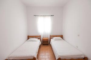 Postel nebo postele na pokoji v ubytování Madalenas B&B