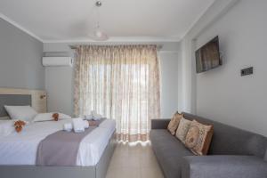 Posteľ alebo postele v izbe v ubytovaní Michaelangelo Apartments