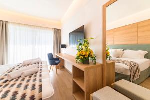 Postel nebo postele na pokoji v ubytování Acandia Hotel