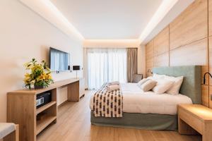 Postel nebo postele na pokoji v ubytování Acandia Hotel
