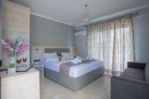 Posteľ alebo postele v izbe v ubytovaní Michaelangelo Apartments