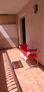 a living room with two chairs and a couch at appartamento Claudia in Roccalumera